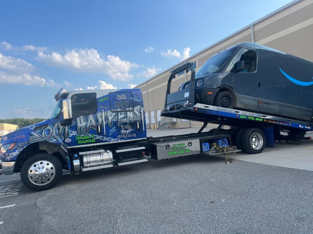 Soot Happens rollback transporting a delivery van